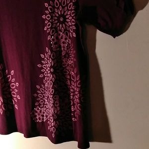 Wine colored blouse.